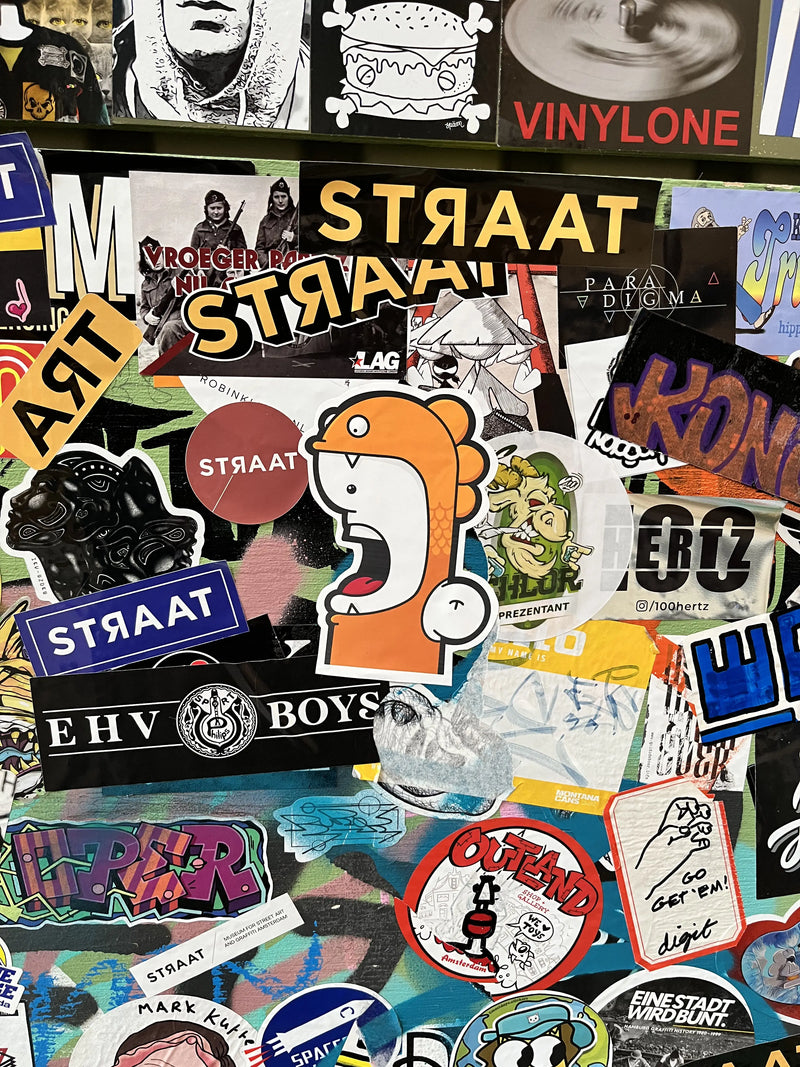 Shouter vs Fish sticker at Straat museum in Amsterdam
