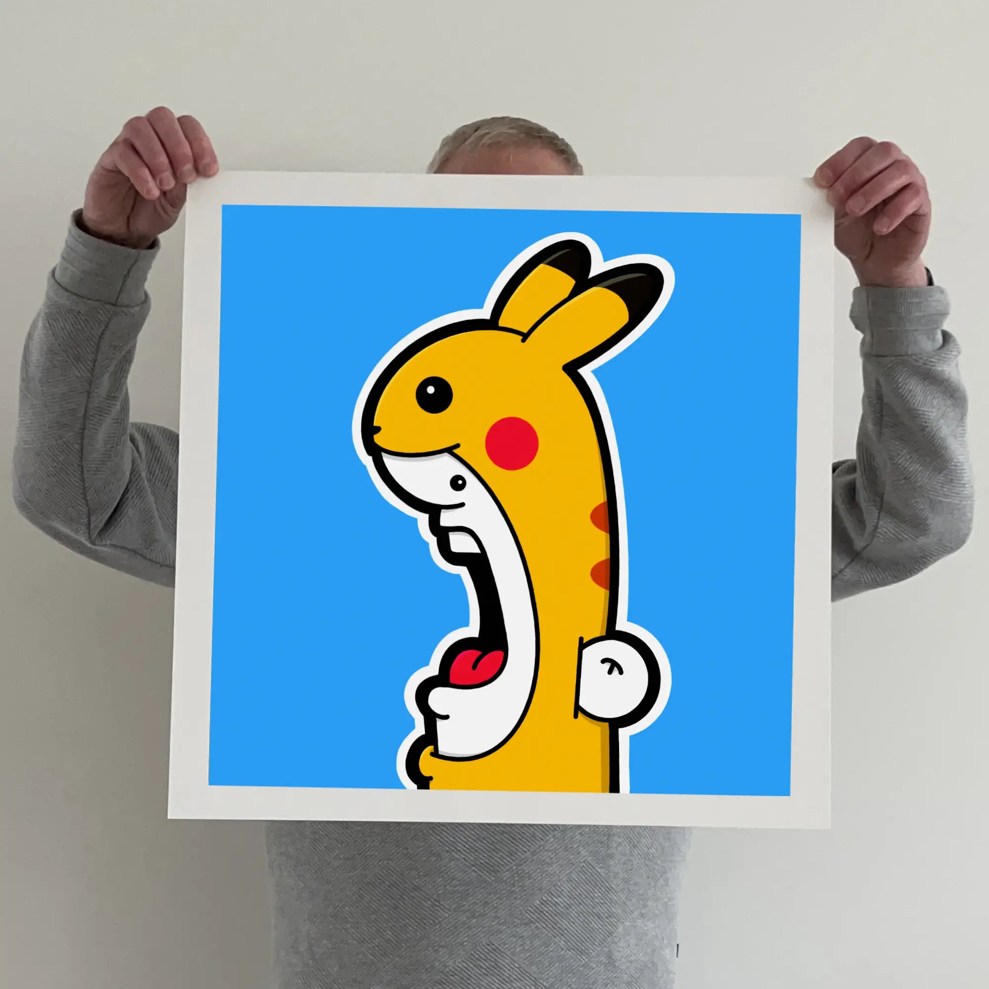 Ran holding a "shouter vs pikachu" print 